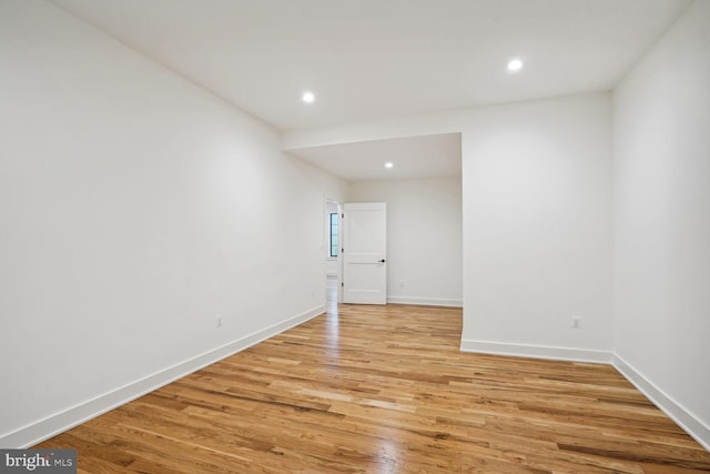 spare room featuring light hardwood / wood-style flooring