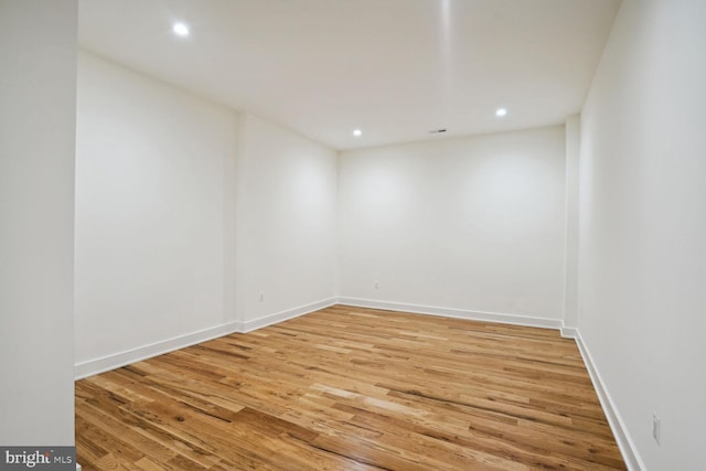 unfurnished room with light hardwood / wood-style floors