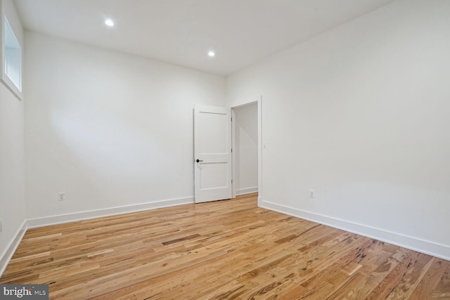 spare room with light wood-type flooring