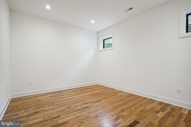 empty room with light hardwood / wood-style floors