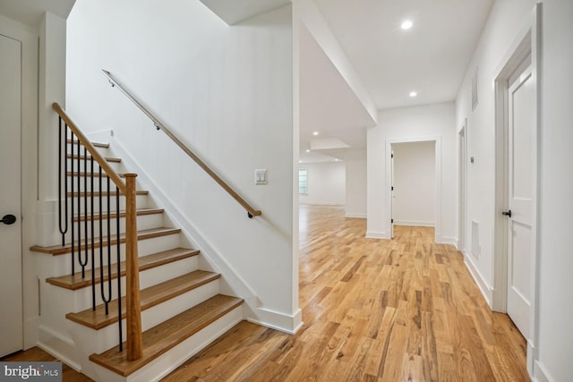 stairs with wood-type flooring