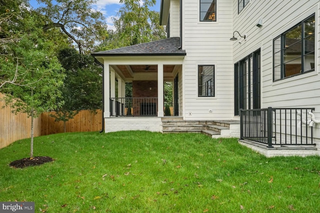 view of yard with ceiling fan