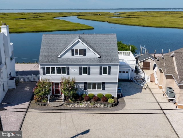 birds eye view of property with a water view