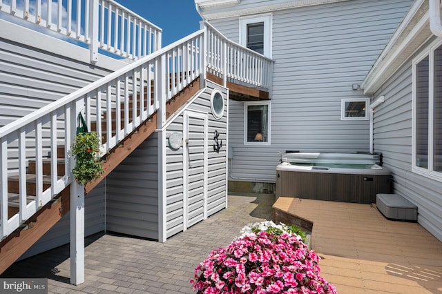 exterior space featuring a hot tub and a patio area