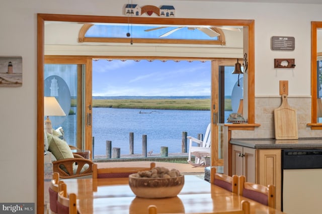 dining area featuring a water view