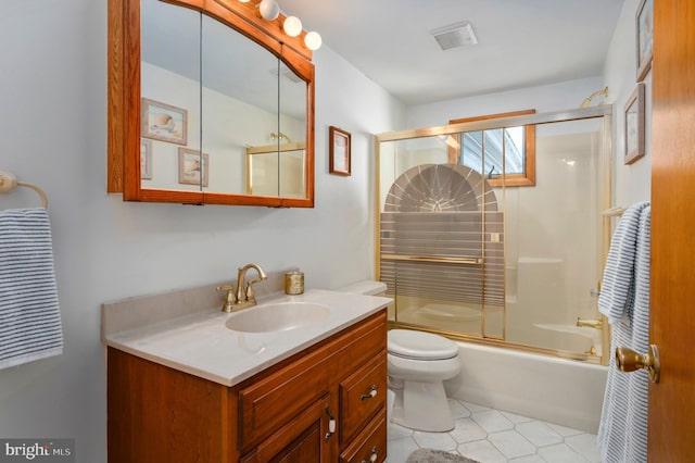 full bathroom with vanity, toilet, combined bath / shower with glass door, and tile patterned flooring