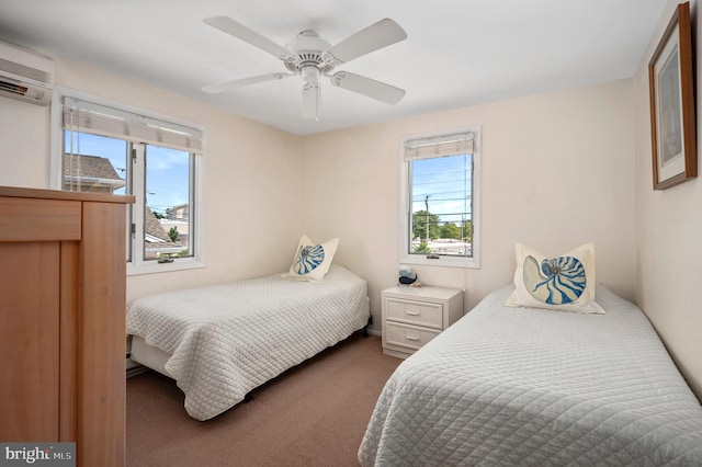 bedroom featuring an AC wall unit, carpet flooring, multiple windows, and ceiling fan