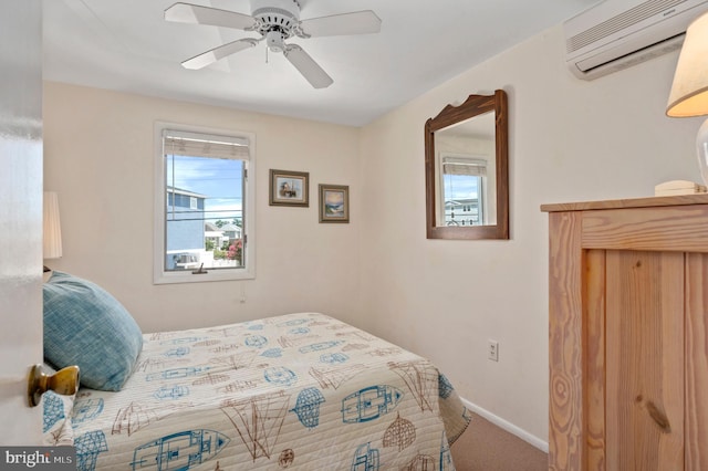 carpeted bedroom with ceiling fan and an AC wall unit