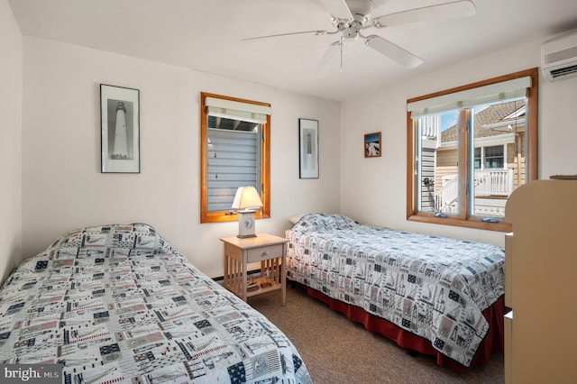 carpeted bedroom with a wall mounted air conditioner and ceiling fan