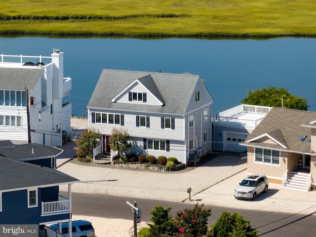 birds eye view of property featuring a water view