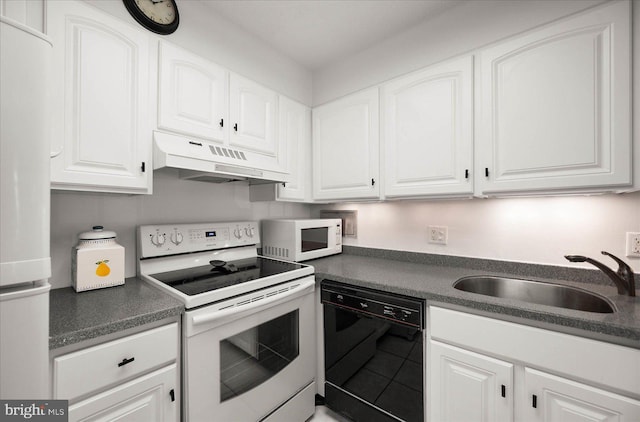 kitchen with white appliances, sink, and white cabinets