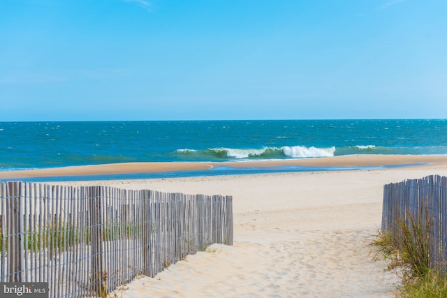 property view of water featuring a beach view