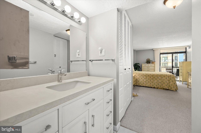 bathroom featuring vanity and a textured ceiling