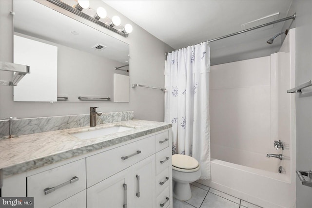 full bathroom featuring shower / bath combo with shower curtain, vanity, tile patterned flooring, and toilet