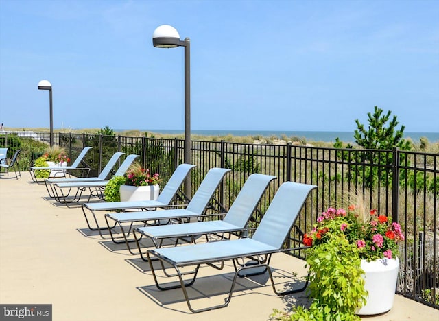 view of patio featuring a water view