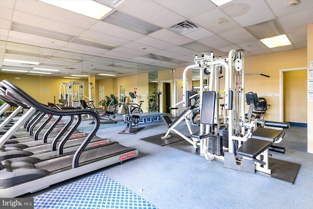 workout area with a drop ceiling