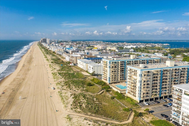 bird's eye view with a beach view and a water view