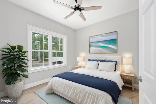 bedroom featuring light wood-type flooring and ceiling fan