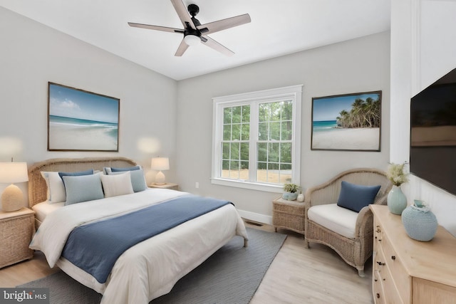 bedroom featuring light hardwood / wood-style flooring and ceiling fan