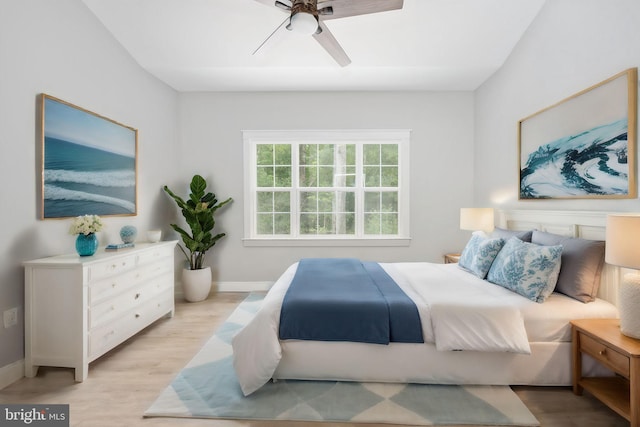 bedroom featuring ceiling fan and light hardwood / wood-style flooring