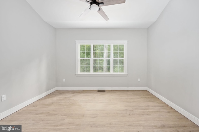 empty room featuring light wood-type flooring and ceiling fan