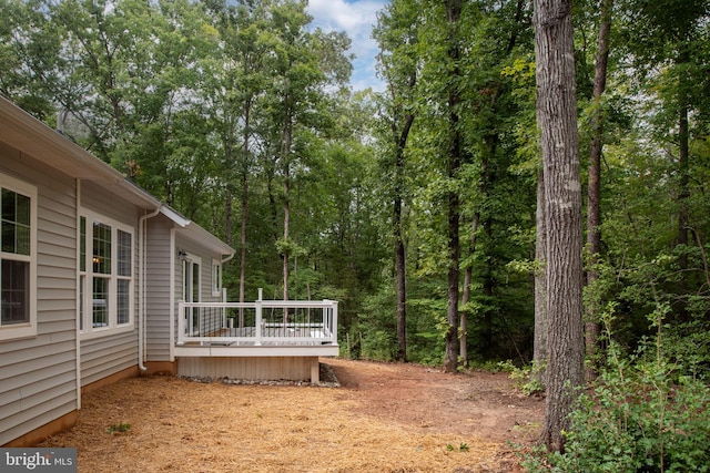 view of yard with a wooden deck