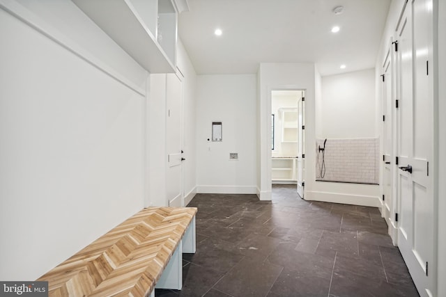 mudroom featuring baseboards, stone finish floor, and recessed lighting