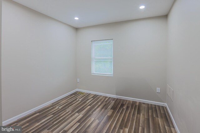 empty room featuring dark wood-type flooring