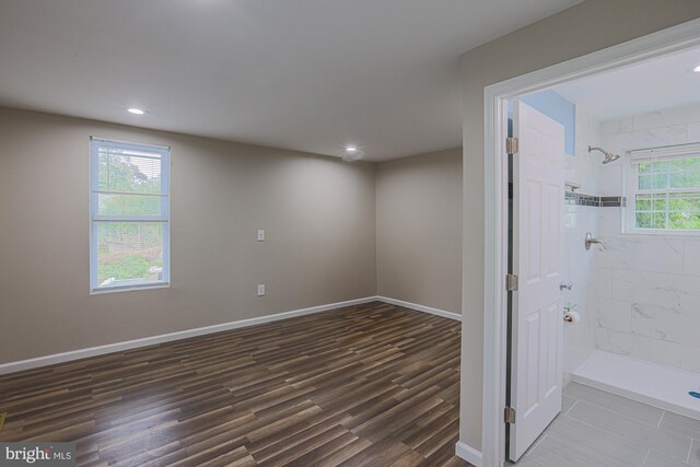 interior space featuring wood-type flooring and a healthy amount of sunlight