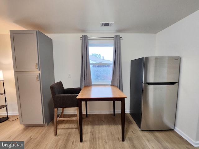 dining room featuring light hardwood / wood-style flooring