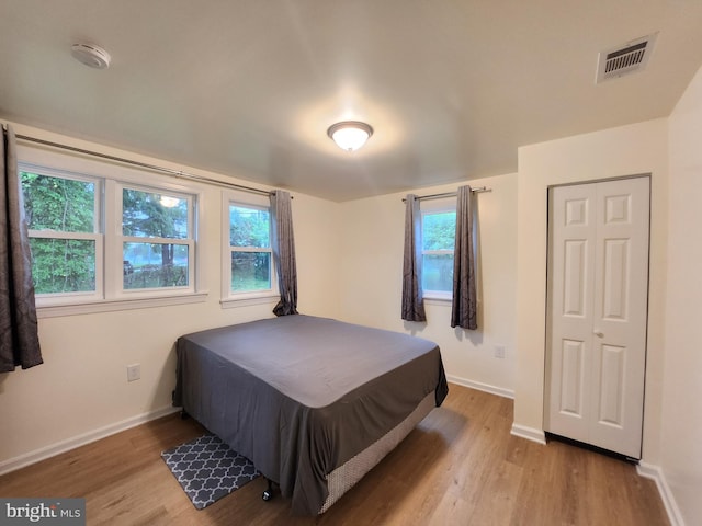 bedroom with light hardwood / wood-style flooring