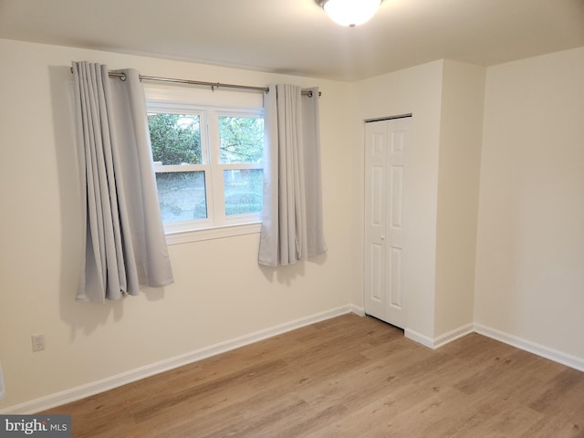 spare room featuring light hardwood / wood-style flooring