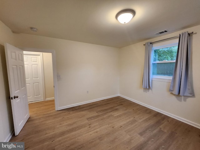 empty room featuring hardwood / wood-style floors