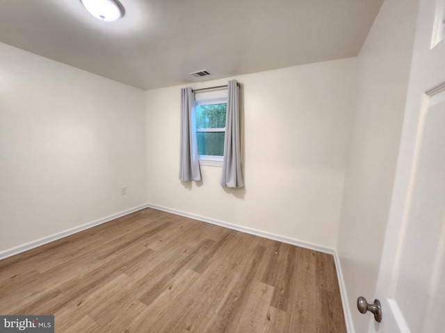 spare room with light hardwood / wood-style floors