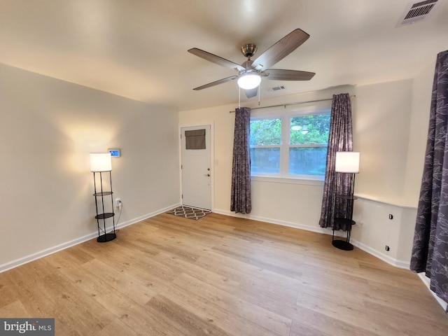 interior space with light hardwood / wood-style floors and ceiling fan