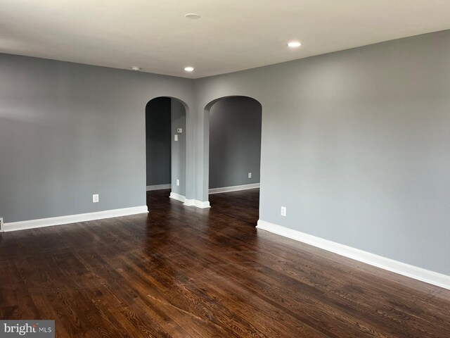 full bathroom featuring shower / tub combo, hardwood / wood-style flooring, toilet, and vanity