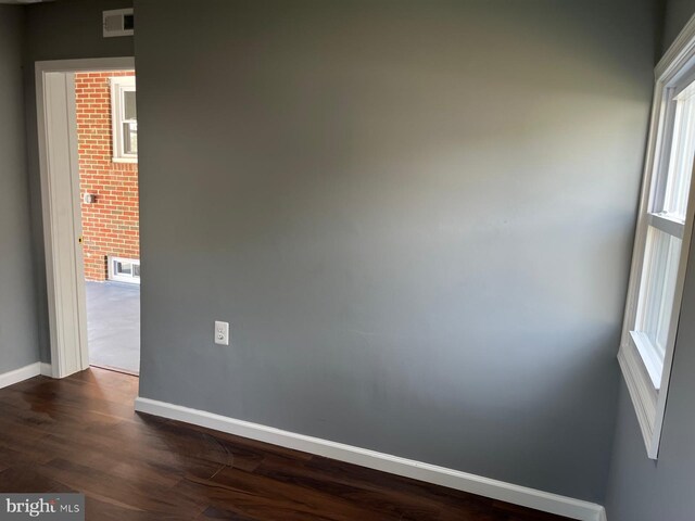 empty room featuring wood-type flooring