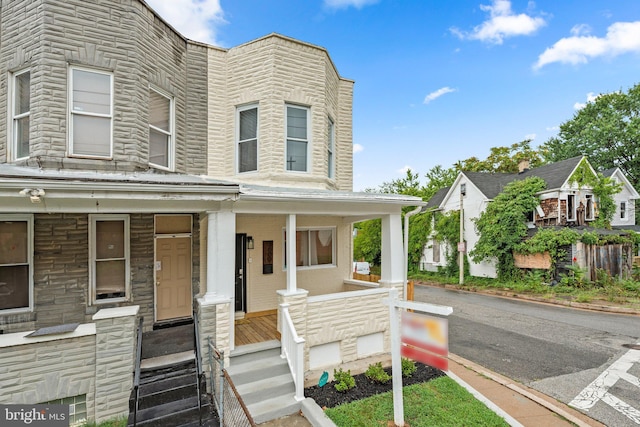 view of property with covered porch