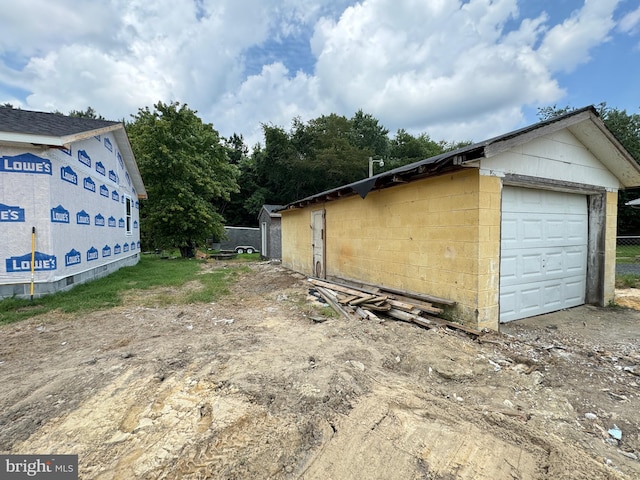 view of property exterior featuring a garage