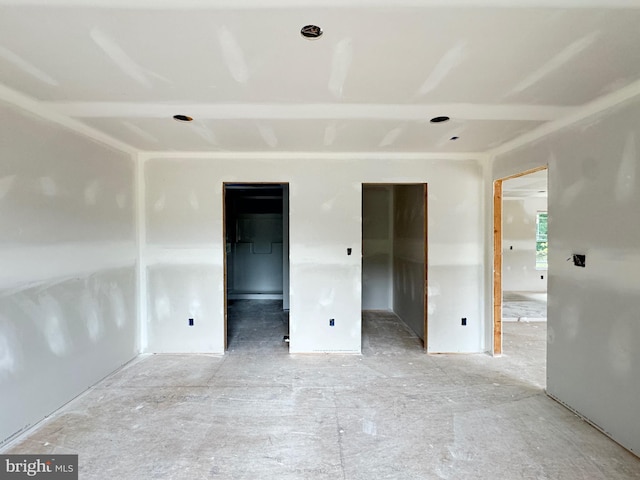 unfurnished bedroom featuring a spacious closet