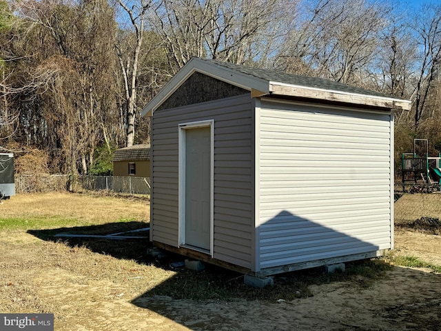 view of outbuilding featuring a lawn