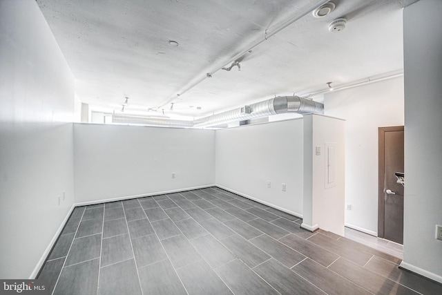 basement featuring wood-type flooring