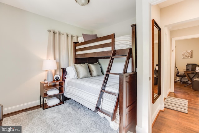 bedroom featuring hardwood / wood-style flooring