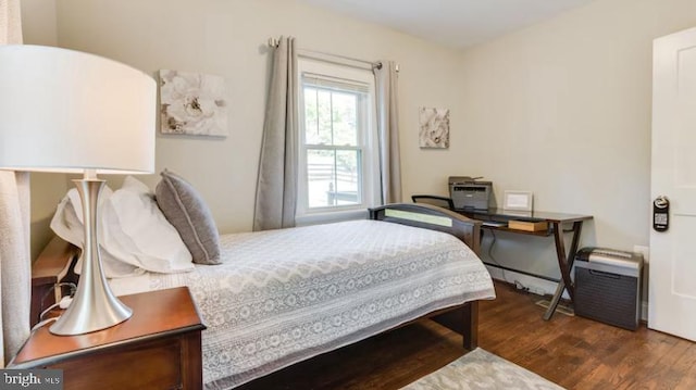 bedroom featuring dark hardwood / wood-style flooring