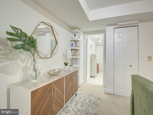 hallway with light carpet