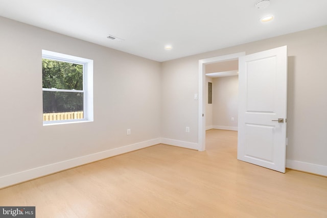 unfurnished room featuring light wood-type flooring