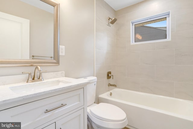 full bathroom featuring vanity, toilet, and tiled shower / bath combo