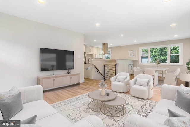 living room with light hardwood / wood-style flooring