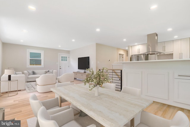 dining area with light hardwood / wood-style flooring