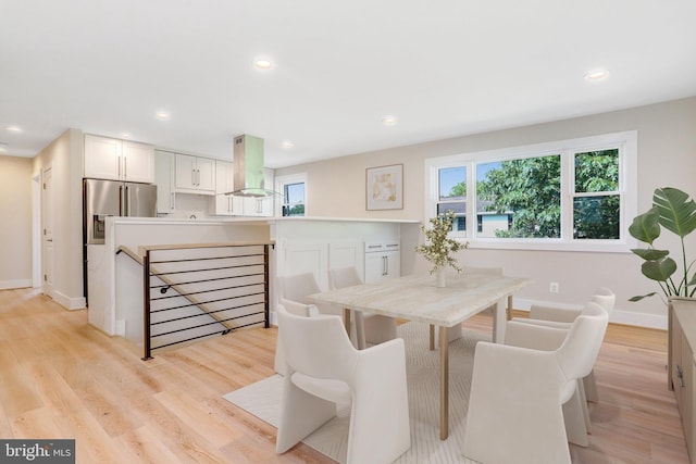 dining space featuring light hardwood / wood-style flooring